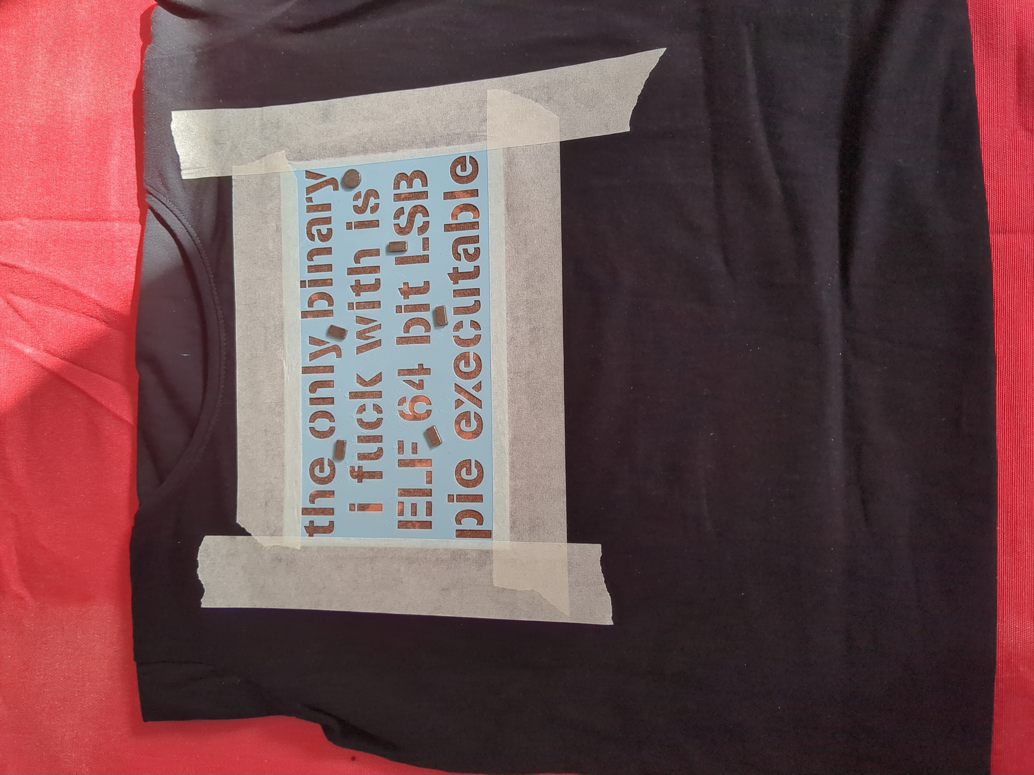 Letters beneath the stencil are changing to gold