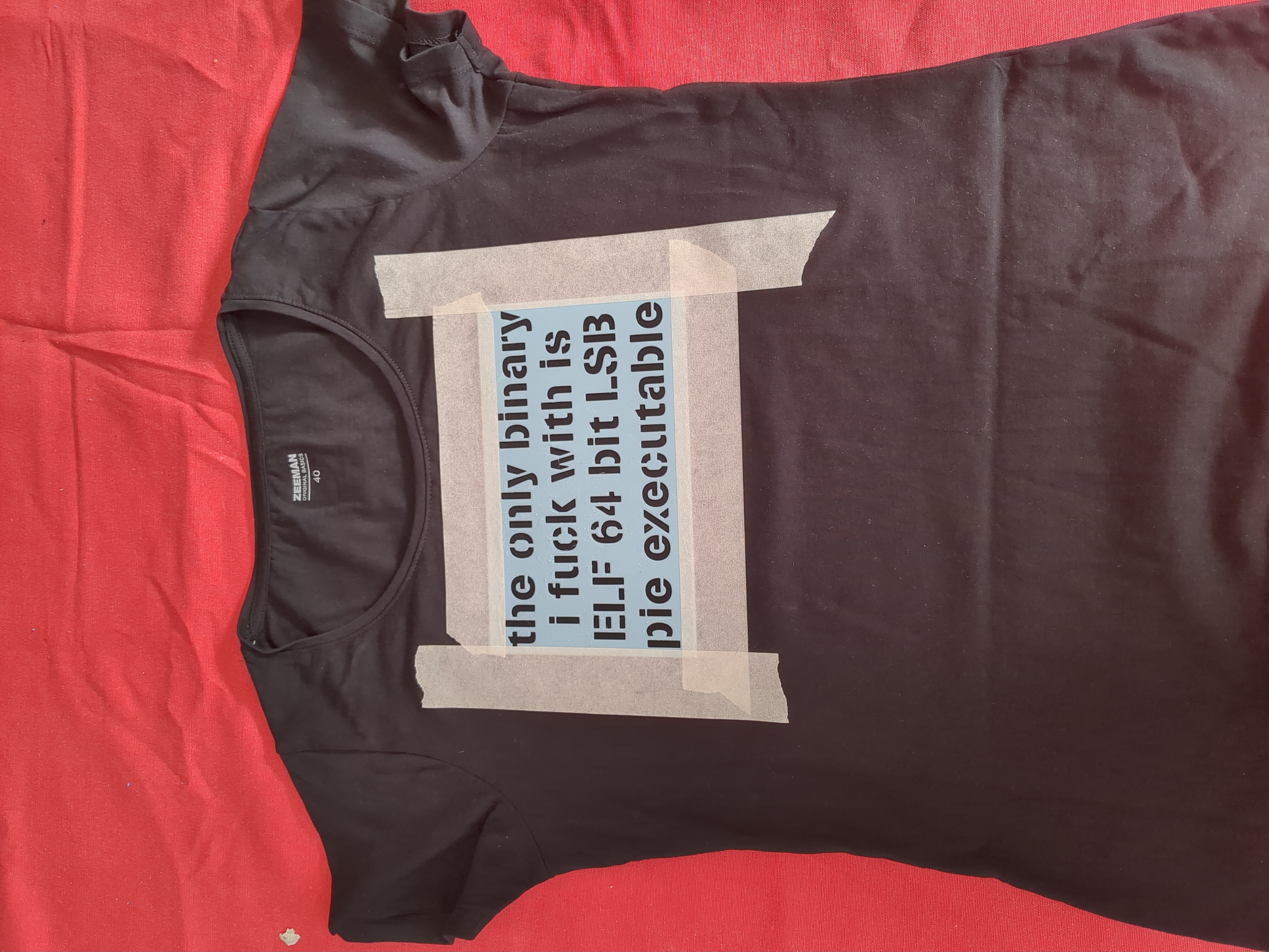Stencil taped to the shirt